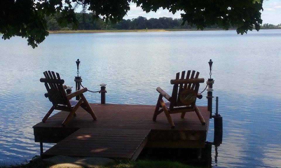 The Lakeside Dock and much loved log chairs over look our quiet lake